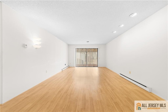 40 Haddon Rd Unit 40B, Monroe, NJ 08831 - spare room with a baseboard heating unit, light wood-type flooring, and recessed lighting