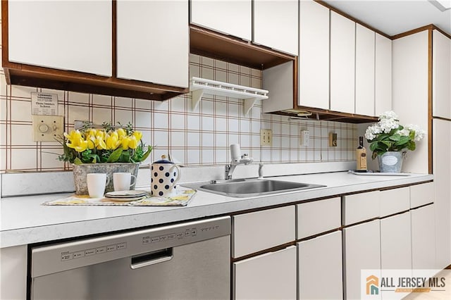40 Haddon Rd Unit 40B, Monroe, NJ 08831 - kitchen with dishwasher, a sink, white cabinets, and light countertops