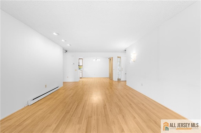 40 Haddon Rd Unit 40B, Monroe, NJ 08831 - spare room with a baseboard heating unit, light wood-style flooring, and recessed lighting