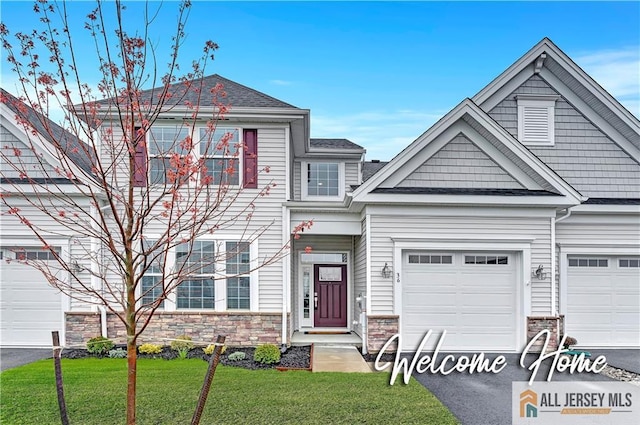 36 Aqueduct Blvd, Plumsted, NJ 08533 - multi unit property featuring stone siding, asphalt driveway, a front lawn, and an attached garage