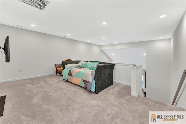 carpeted bedroom featuring recessed lighting, baseboards, and visible vents