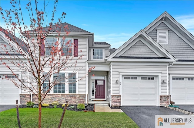 36 Aqueduct Blvd, Plumsted, NJ 08533 - view of property with stone siding, asphalt driveway, a front lawn, and an attached garage