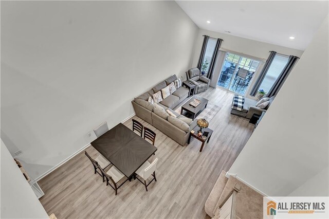 living room featuring recessed lighting and light wood-style flooring