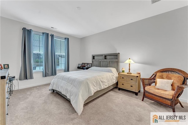 bedroom featuring carpet flooring, baseboards, and visible vents