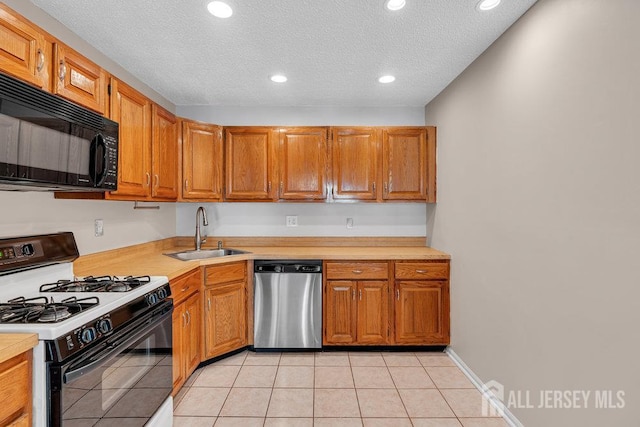 47 Covington Ct, East Brunswick, NJ 08816 - kitchen with range with gas cooktop, dishwasher, black microwave, light countertops, and recessed lighting