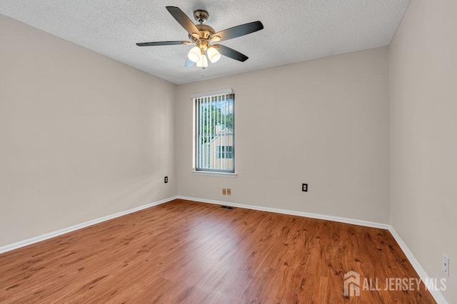 47 Covington Ct, East Brunswick, NJ 08816 - empty room with wood finished floors, a textured ceiling, and a ceiling fan