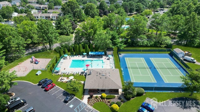 47 Covington Ct, East Brunswick, NJ 08816 - drone / aerial view of a pool and a tree filled landscape
