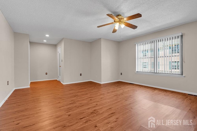 47 Covington Ct, East Brunswick, NJ 08816 - empty room featuring light wood finished floors, a textured ceiling, ceiling fan, and recessed lighting