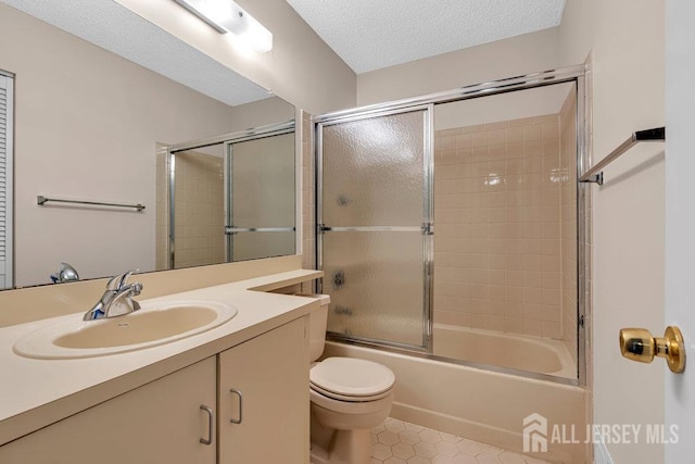47 Covington Ct, East Brunswick, NJ 08816 - bathroom featuring tile patterned flooring, vanity, combined bath / shower with glass door, and a textured ceiling