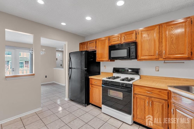 47 Covington Ct, East Brunswick, NJ 08816 - kitchen with black appliances, light countertops, light tile patterned floors, recessed lighting, and a textured ceiling