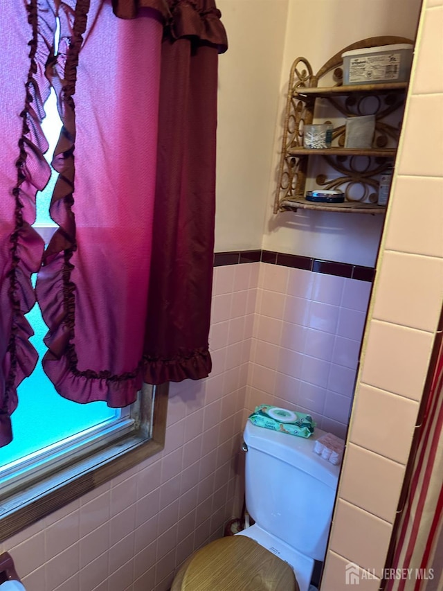 359 Parkway Ave, Trenton, NJ 08618 - half bathroom featuring tile walls and wainscoting