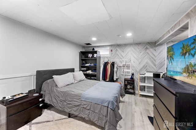 bedroom featuring wood finished floors and recessed lighting