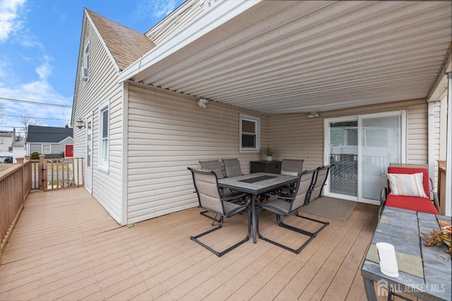 wooden terrace featuring outdoor dining area