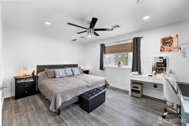 bedroom with recessed lighting, baseboards, and wood finished floors