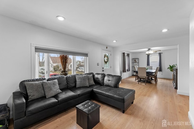 living area featuring recessed lighting, baseboards, light wood-style flooring, and ceiling fan