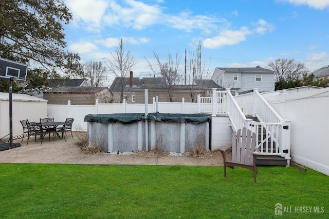 view of pool with a fenced in pool, a fenced backyard, a yard, and a patio area