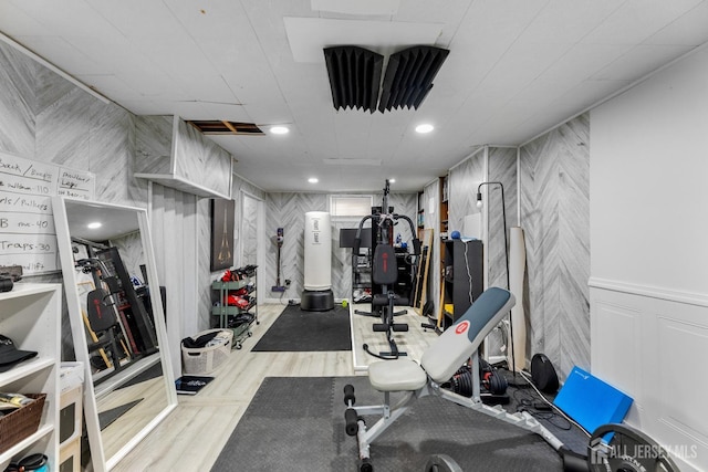 interior space with wood finished floors and recessed lighting