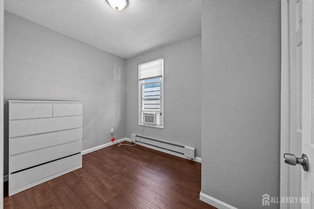 41 Guilden St, New Brunswick, NJ 08901 - spare room featuring a baseboard radiator, wood finished floors, and cooling unit
