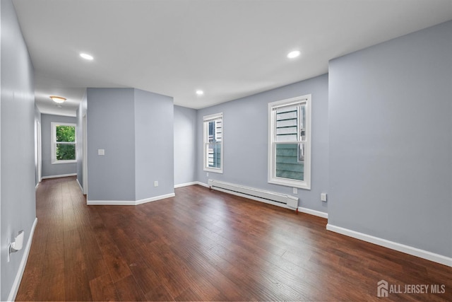 41 Guilden St, New Brunswick, NJ 08901 - empty room with a baseboard heating unit, dark wood-type flooring, and recessed lighting