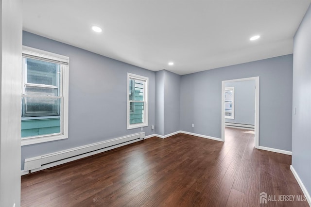41 Guilden St, New Brunswick, NJ 08901 - spare room with a baseboard radiator, dark wood finished floors, plenty of natural light, and recessed lighting