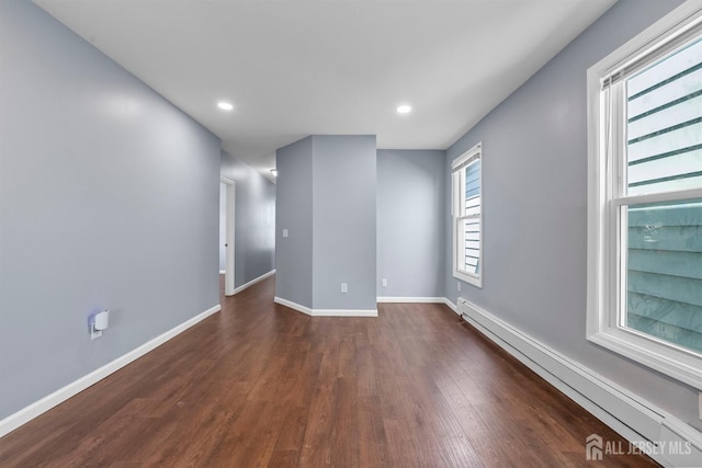 41 Guilden St, New Brunswick, NJ 08901 - unfurnished room featuring baseboard heating, dark wood finished floors, and recessed lighting