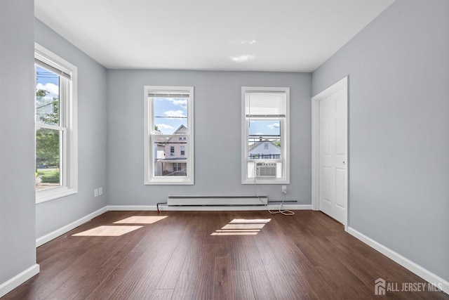 41 Guilden St, New Brunswick, NJ 08901 - empty room featuring a baseboard heating unit, plenty of natural light, wood finished floors, and cooling unit