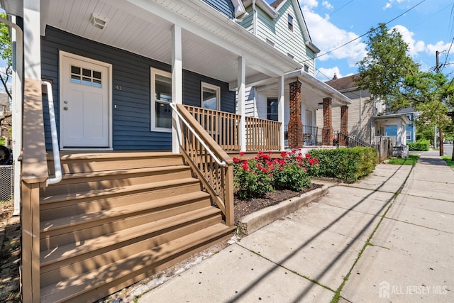 41 Guilden St, New Brunswick, NJ 08901 - doorway to property with a porch
