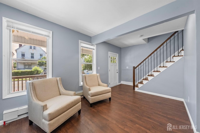 41 Guilden St, New Brunswick, NJ 08901 - living area with baseboard heating, stairway, and dark wood finished floors