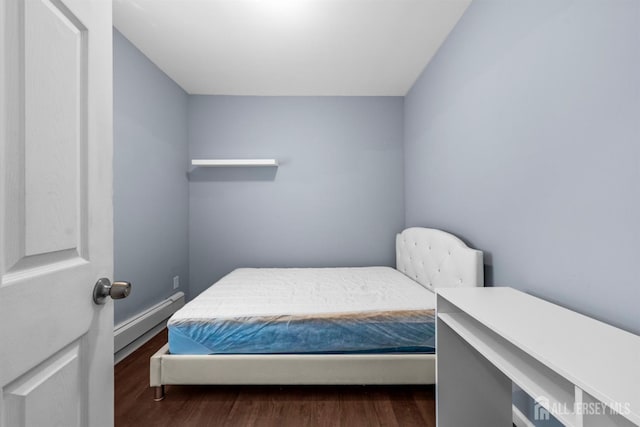 41 Guilden St, New Brunswick, NJ 08901 - bedroom featuring a baseboard radiator and dark wood finished floors