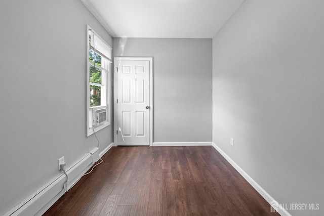 41 Guilden St, New Brunswick, NJ 08901 - unfurnished bedroom with baseboard heating, wood finished floors, and cooling unit