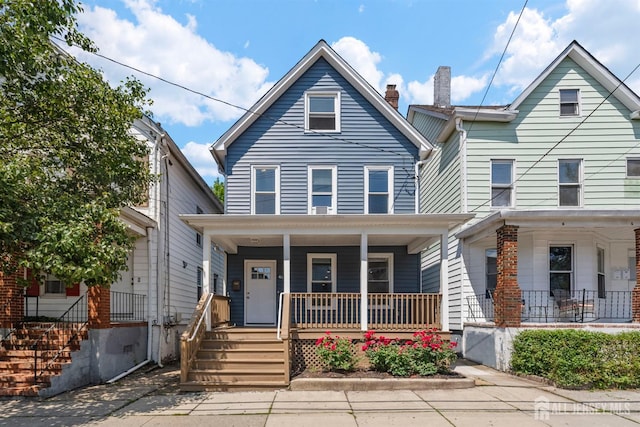 41 Guilden St, New Brunswick, NJ 08901 - view of front of home featuring a porch and a chimney