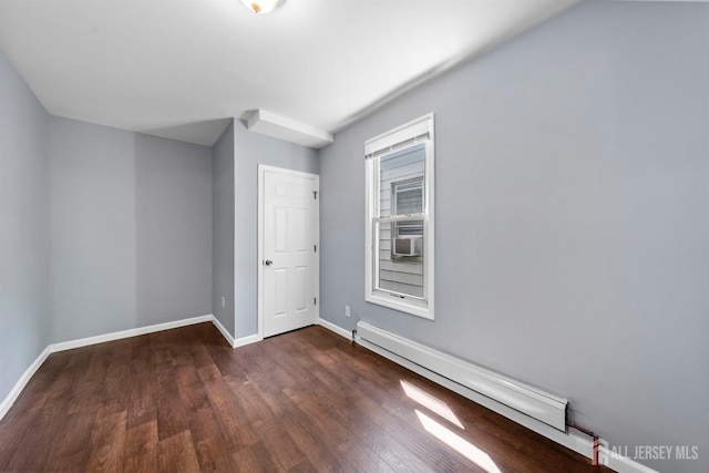 41 Guilden St, New Brunswick, NJ 08901 - unfurnished room with a baseboard radiator, wood finished floors, and cooling unit