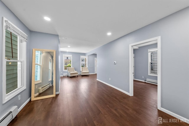 41 Guilden St, New Brunswick, NJ 08901 - unfurnished living room with a baseboard heating unit, baseboard heating, dark wood-type flooring, and recessed lighting