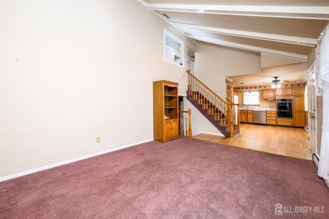 unfurnished living room with light carpet, beam ceiling, a sink, baseboards, and stairs