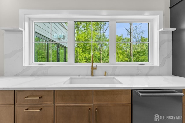 116 Hunt Dr, Princeton, NJ 08540 - kitchen featuring dishwasher, a sink, light stone counters, and brown cabinets