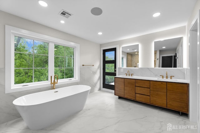 116 Hunt Dr, Princeton, NJ 08540 - bathroom with double vanity, a freestanding tub, marble tiled floors, healthy amount of natural light, and recessed lighting