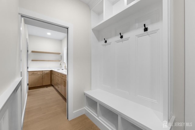 116 Hunt Dr, Princeton, NJ 08540 - mudroom featuring a sink and light wood-style flooring