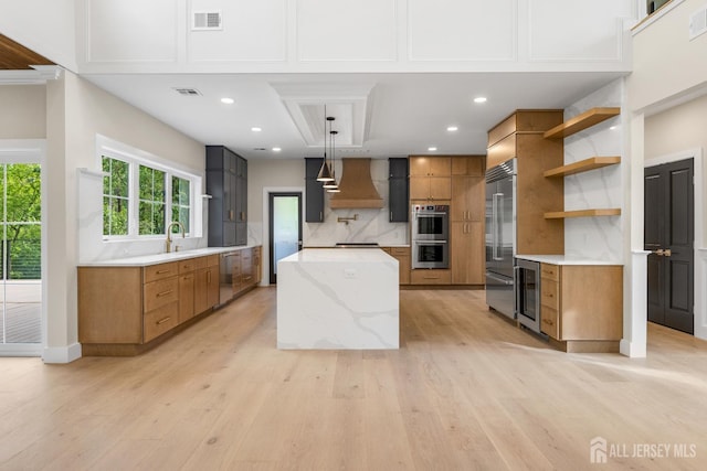 116 Hunt Dr, Princeton, NJ 08540 - kitchen featuring open shelves, stainless steel appliances, wine cooler, a center island, and brown cabinets