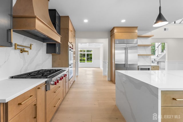 116 Hunt Dr, Princeton, NJ 08540 - kitchen with custom range hood, open shelves, decorative backsplash, light wood-style flooring, and appliances with stainless steel finishes
