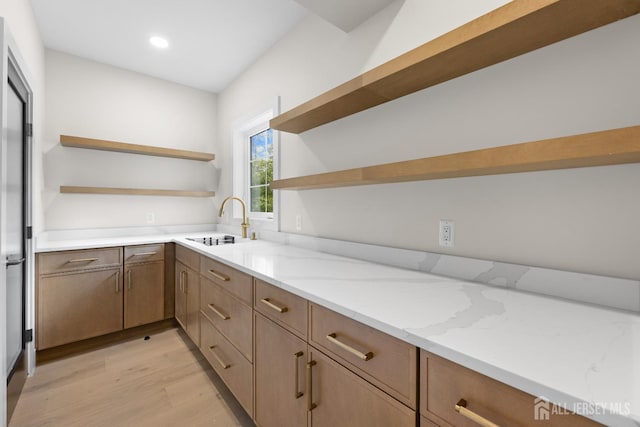116 Hunt Dr, Princeton, NJ 08540 - kitchen featuring open shelves, a sink, light wood finished floors, light stone counters, and recessed lighting