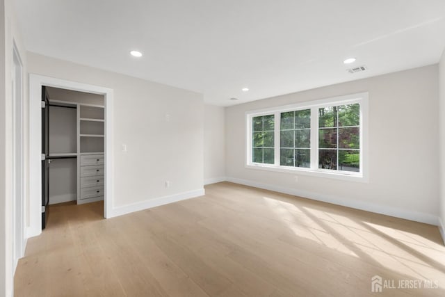 116 Hunt Dr, Princeton, NJ 08540 - unfurnished bedroom featuring light wood-style flooring, baseboards, recessed lighting, a walk in closet, and a closet