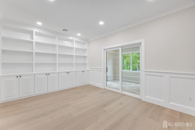 116 Hunt Dr, Princeton, NJ 08540 - empty room featuring ornamental molding, light wood-type flooring, a decorative wall, recessed lighting, and a wainscoted wall