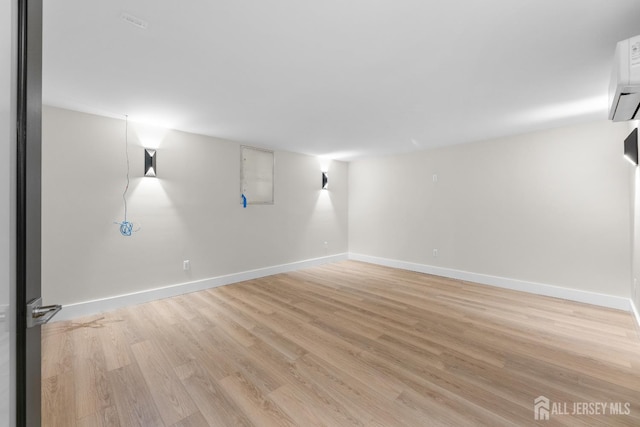 116 Hunt Dr, Princeton, NJ 08540 - spare room featuring light wood-style floors, baseboards, and a wall mounted AC
