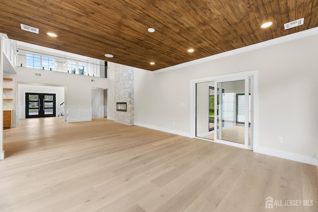 116 Hunt Dr, Princeton, NJ 08540 - unfurnished living room featuring wood ceiling, plenty of natural light, a fireplace, light wood-type flooring, and french doors
