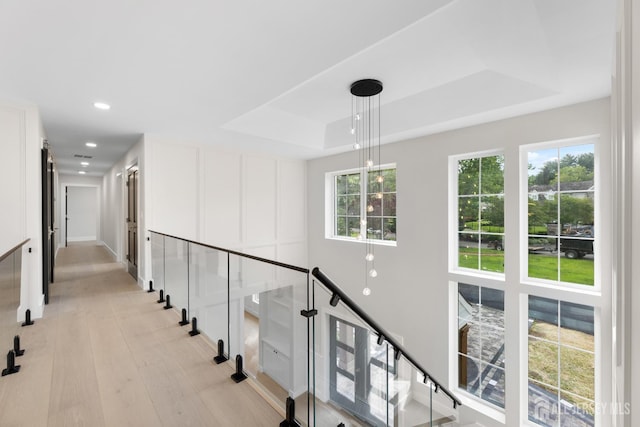 116 Hunt Dr, Princeton, NJ 08540 - hallway with a tray ceiling, healthy amount of natural light, an upstairs landing, light wood-style flooring, and recessed lighting
