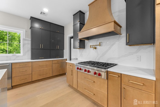 116 Hunt Dr, Princeton, NJ 08540 - kitchen featuring custom exhaust hood, appliances with stainless steel finishes, light wood finished floors, and decorative backsplash