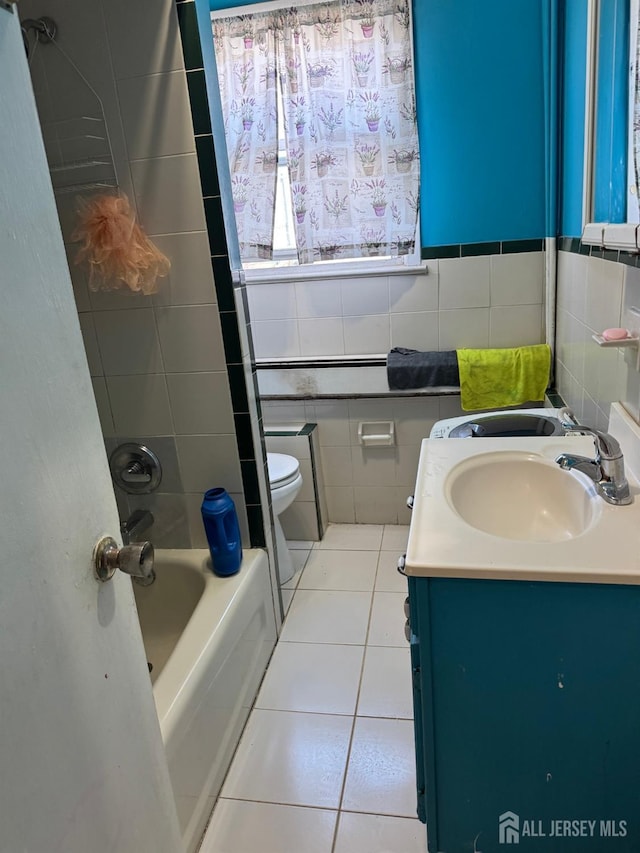 87-89 1st St, Perth Amboy, NJ 08861 - full bath with tile patterned flooring, vanity, shower / bathing tub combination, tile walls, and toilet