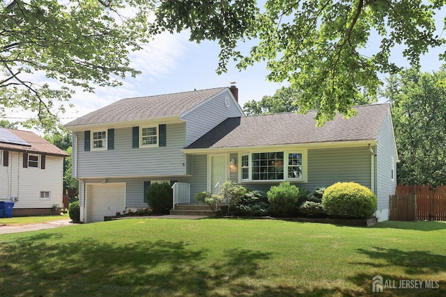 505 Runyon Ave, Piscataway, NJ 08854 - split level home with concrete driveway, a chimney, a garage, and roof with shingles