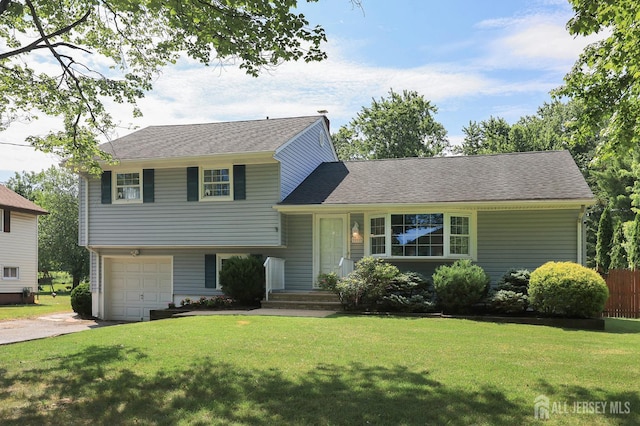 505 Runyon Ave, Piscataway, NJ 08854 - split level home featuring driveway, an attached garage, and roof with shingles