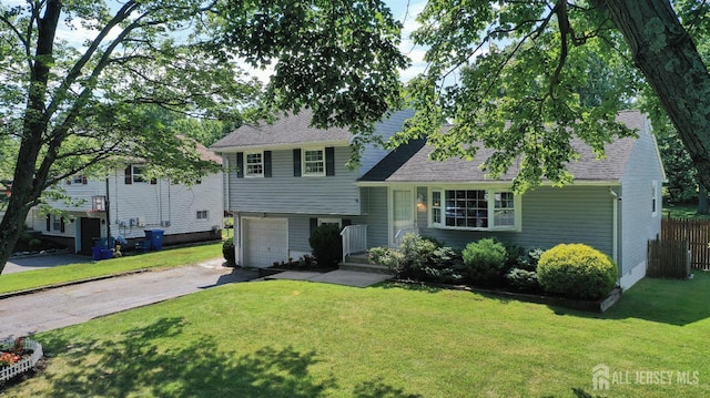505 Runyon Ave, Piscataway, NJ 08854 - split level home featuring asphalt driveway, roof with shingles, and an attached garage